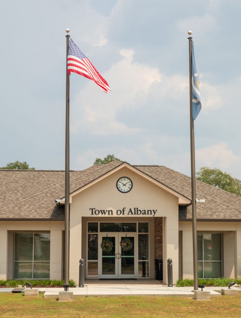 Albany Town Hall exterior with flags