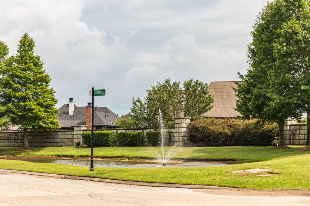 Greystone with pond and fountain