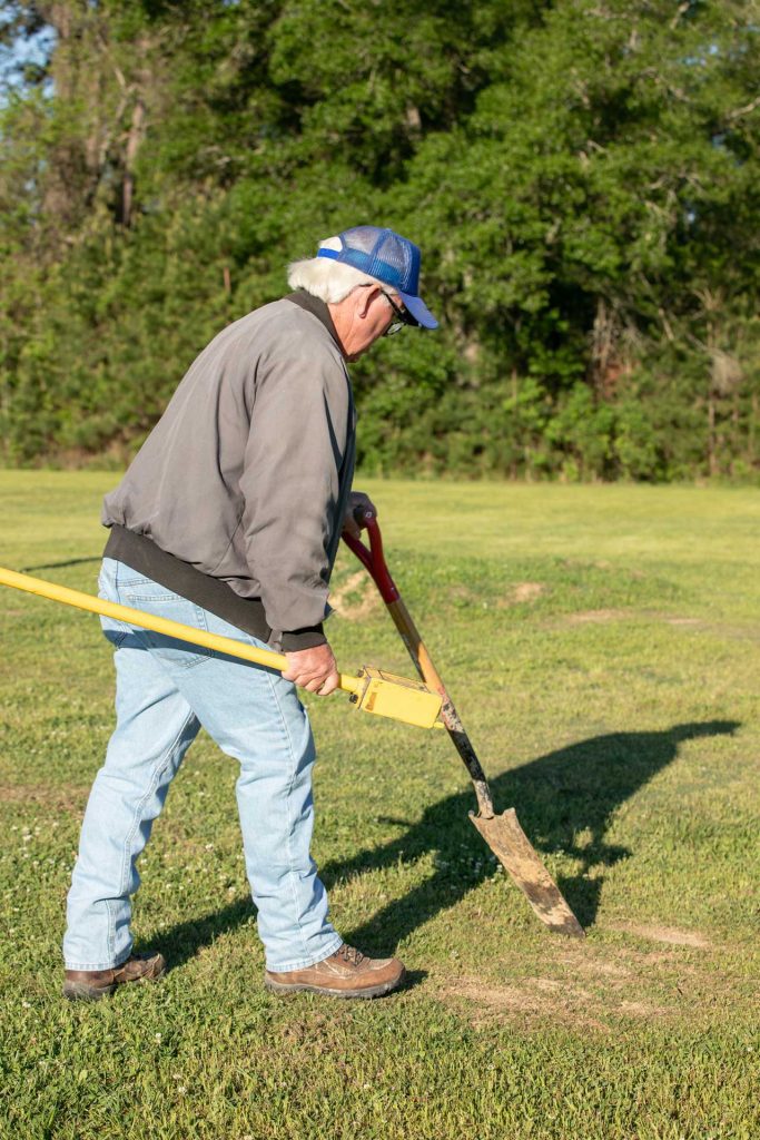 Boundary survey crew member