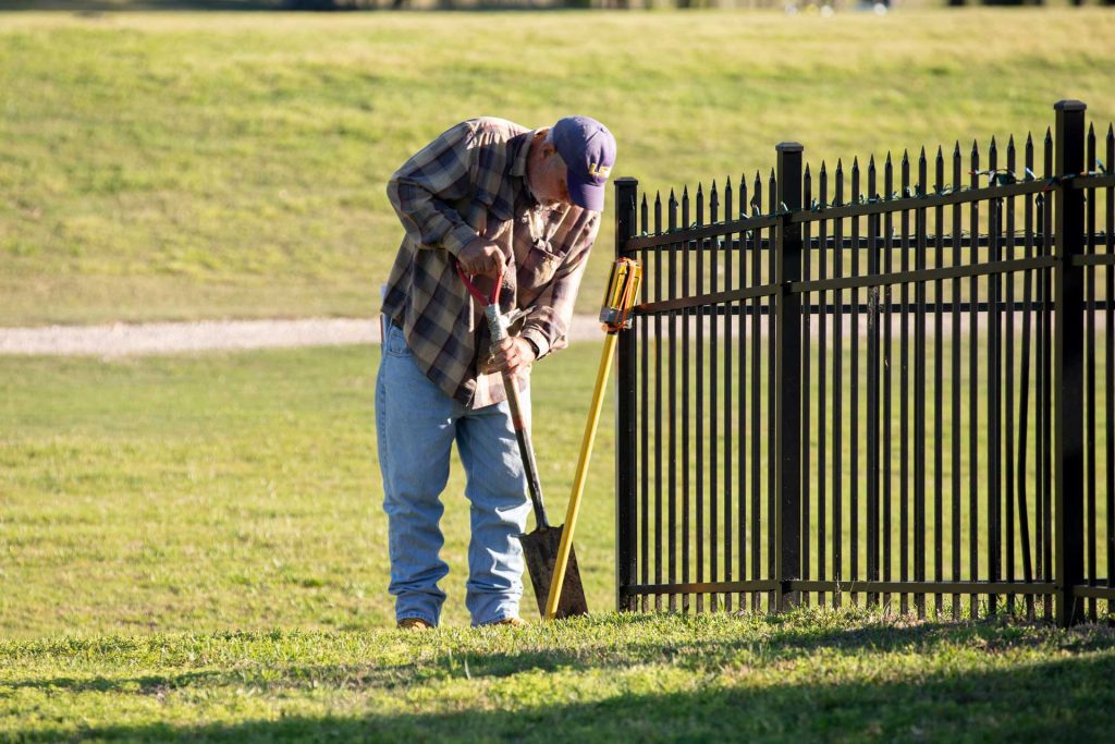 Boundary survey crew member